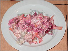 Fresh cabbage salad with beets, peas, apples, ham, chicken meat