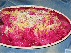 Herring salad with red beets, puffed.